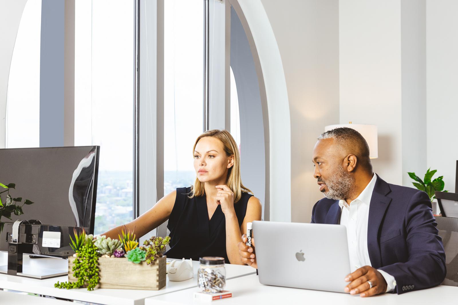 Two people working at computers